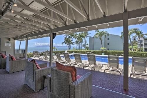 a covered patio with chairs and a swimming pool at Beach Access and Community Perks Hawaii Haven in Kaunakakai