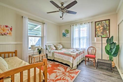 a bedroom with a bed and a ceiling fan at Papaikou Escape Less Than 3 Mi to Botanical Garden! in Papaikou
