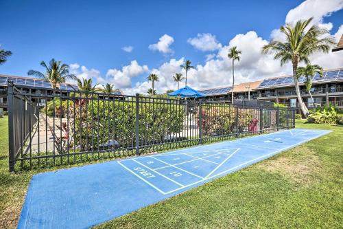 a tennis court in front of a building at Lush Molokai Island Oasis with Private Pool and Beach! in Kaunakakai