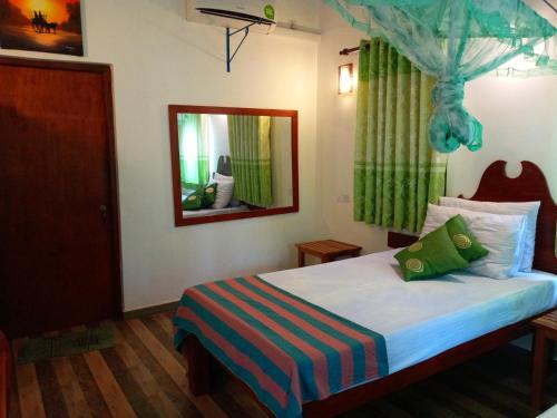 Postel nebo postele na pokoji v ubytování Hideaway Homestay Habarana
