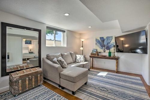 a living room with a couch and a chair at 4 Mi to Coors Field Charming Apartment with Patio in Denver
