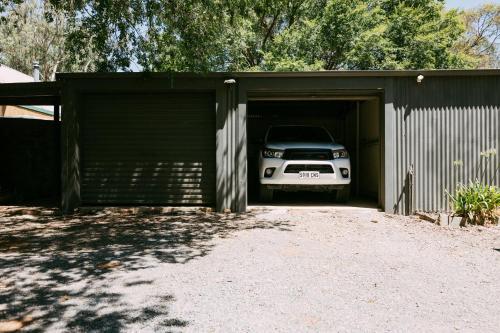 a car is parked inside of a garage at Mintaro Hideaway in Mintaro