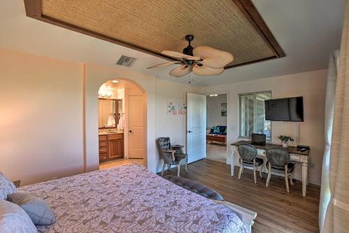 a bedroom with a bed with a ceiling fan at Waimea Condo Less Than 1 Mile from Mauna Lani Beach Club! in Waikoloa
