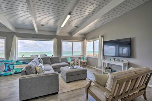 a living room with a couch and a tv at WFH in Paradise Beachfront Hauula Getaway! in Laie