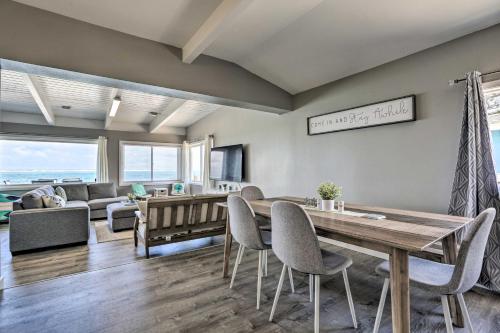 a living room with a table and chairs and a couch at WFH in Paradise Beachfront Hauula Getaway! in Laie
