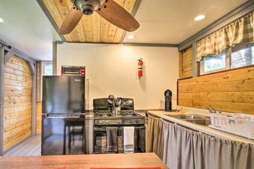 a kitchen with a stainless steel refrigerator and a sink at Idyllic Pahoa Paradise Hike, Swim and Explore! in Pahoa