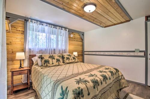 a bedroom with a bed and a window at Idyllic Pahoa Paradise Hike, Swim and Explore! in Pahoa
