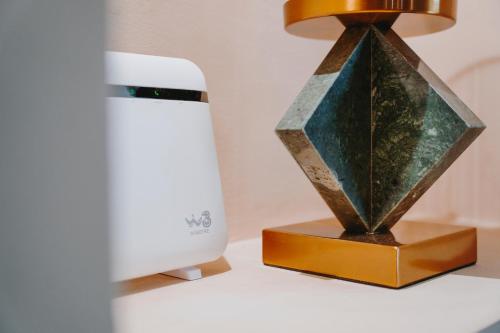 a lamp on a desk next to a computer monitor at Civico 9 in Brindisi
