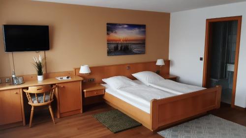 Posteľ alebo postele v izbe v ubytovaní Landhotel Wiesenhof