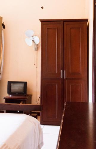 Postel nebo postele na pokoji v ubytování Etana Motel Kampala