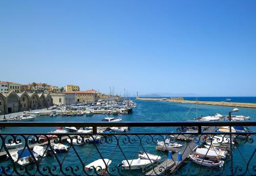 a bunch of boats are docked in a harbor at Porto Veneziano Hotel in Chania Town