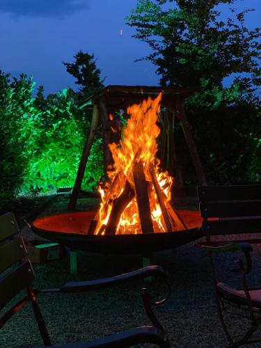 a fire pit in a park at night at Das kleine Landhotel in Dorsten