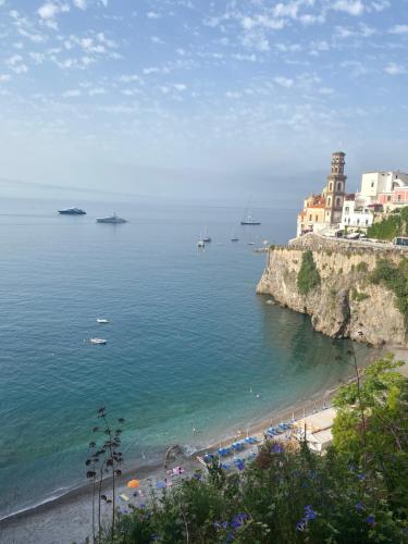 a view of a beach with boats in the water at Idillioravello in Ravello