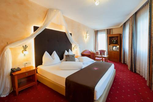 Postel nebo postele na pokoji v ubytování Hotel Engel