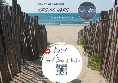 a sign on a fence on the beach at Kyriad Montpellier Ouest St Jean de Védas - A709 in Saint-Jean-de-Védas