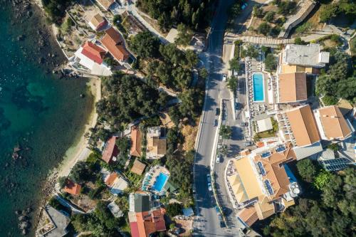 an aerial view of houses and the ocean at Odysseus Hotel in Paleokastritsa
