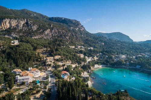 an aerial view of a resort on the shores of a lake at Odysseus Hotel in Paleokastritsa