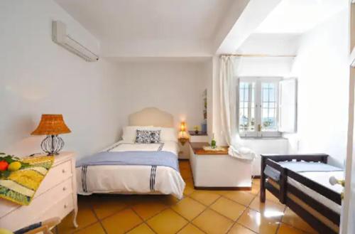 Ένα ή περισσότερα κρεβάτια σε δωμάτιο στο Villa Delle Ginestre - sea view