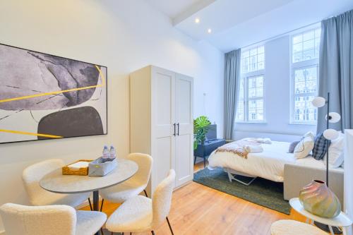 Кровать или кровати в номере Maison Grand Place Studio 5