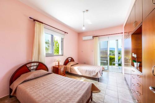 Postel nebo postele na pokoji v ubytování Villa Wisteria