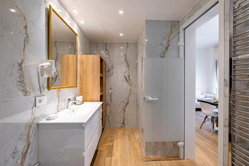 a bathroom with a white sink and a shower at 201- HiEndAccomodation-TopLocation in Athens