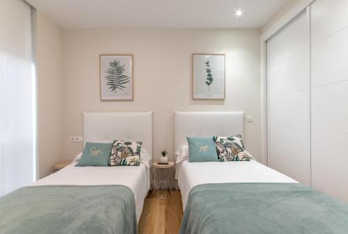 A bed or beds in a room at Nuevo y Luminoso en Plaza Moyua