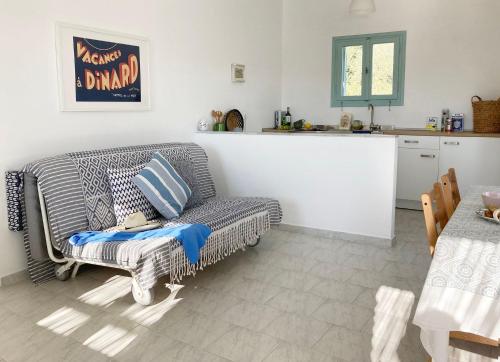 a living room with a couch and a kitchen at Asterias in Panteli