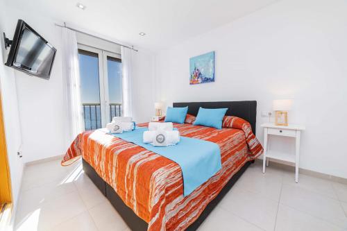 En eller flere senge i et værelse på Apartamento Bellavista Puerto 2B