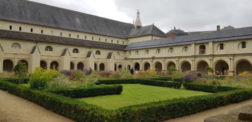 a large building with a garden in front of it at Gîte et chambres d'hôtes Le Chêne Billault in Pouant