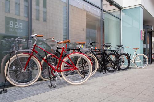 a row of bikes parked in front of a building at Mercure Krakow Stare Miasto in Kraków
