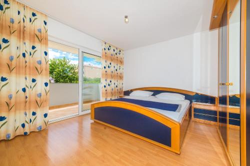 Кровать или кровати в номере Villa Apartments Olivetum