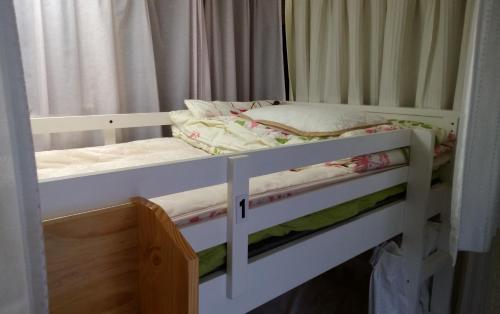 a couple of bunk beds in a room at FukuokaKoryou GuestHouse in Fukuoka
