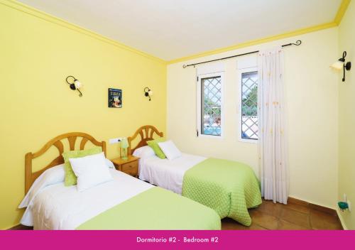 מיטה או מיטות בחדר ב-Villa Berdica near Moraira