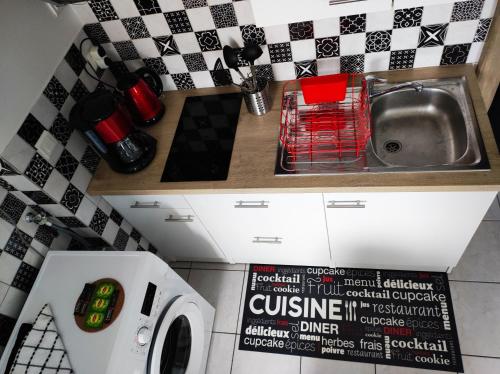 Cuisine ou kitchenette dans l'établissement Le 4midable - Chaleureux 2 pièces