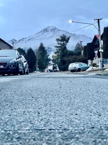 a street with cars parked on the side of a mountain at Sifra 276 in Nová Lesná