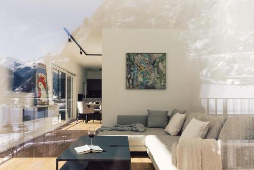 a living room with a couch and a table at Sima-Apartments in Längenfeld