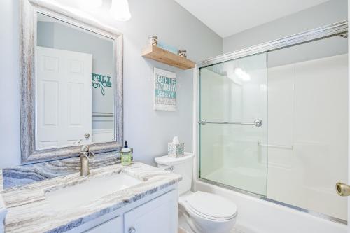a bathroom with a shower and a sink and a toilet at Bethany Bay 2505 Harbor Dr in Ocean View