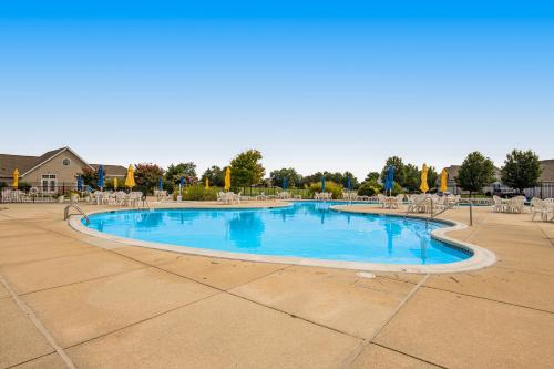 a large swimming pool with chairs and blue water at Bethany Bay 2505 Harbor Dr in Ocean View