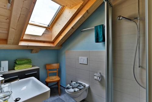 a bathroom with a shower and a sink at BnB Chez Pia in Ernen