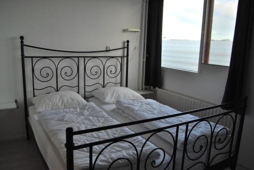 Ένα ή περισσότερα κρεβάτια σε δωμάτιο στο Appartement Walvis nr. 9H