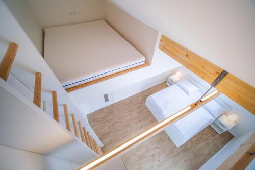 an overhead view of a room with a bed and stairs at Holiday House U Hájenky 9P Lipno Home in Lipno nad Vltavou