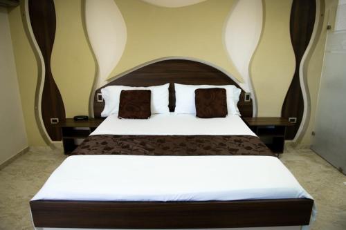 Hotel Diamante Real Cienagaにあるベッド