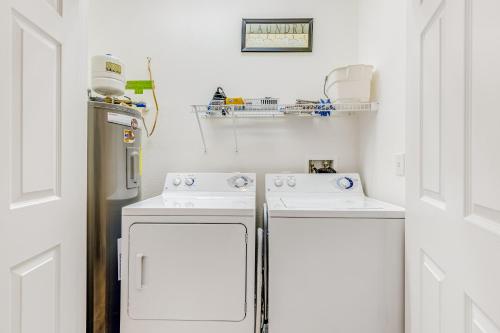 a kitchen with two white appliances and a refrigerator at Bear Trap Dunes - 124G October Glory in Ocean View