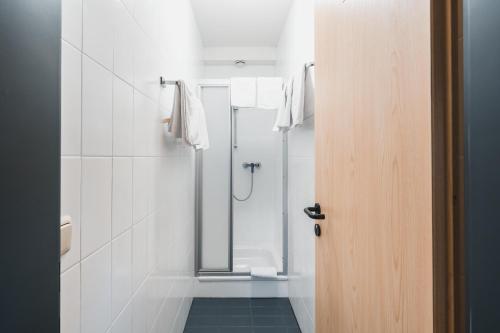 a bathroom with a shower with a glass door at Felbermayer Appartements in Gaschurn