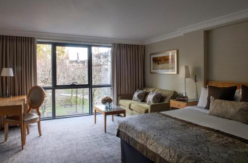 Ένα ή περισσότερα κρεβάτια σε δωμάτιο στο Rhinefield House Hotel