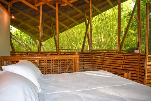 מיטה או מיטות בחדר ב-Eco Hotel Hacienda El Diamante