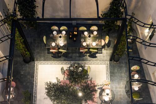 an overhead view of a restaurant with tables and lights at Castro Hotel Syros in Ermoupoli
