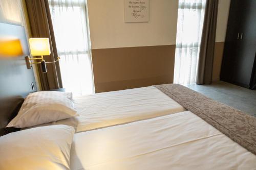 Hotel De Maaskantにあるベッド