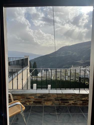 a view of a balcony with a view of a mountain at Hostal Rural Poqueira in Capileira