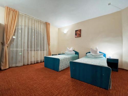 Postel nebo postele na pokoji v ubytování Hotel Belvedere